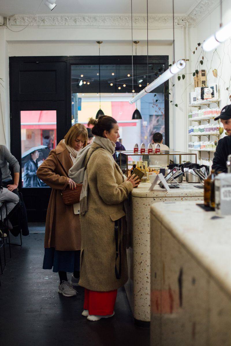 Customers order at a busy café counter